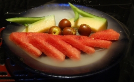 Platter of jujubes, honeydew and watermelon slices on dried ice