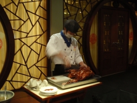 Wait staff carving out Beijing Duck 