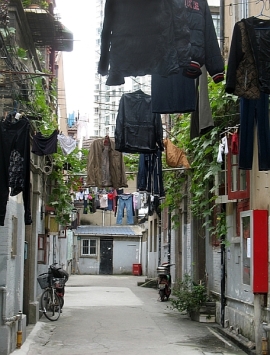 Hutong residents hang their laundry above the alley 