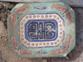 Ceramic drain cover on the Church grounds