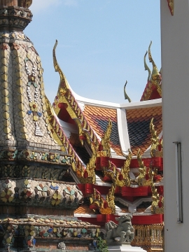 Temple roof gables and chedi in the courtyard