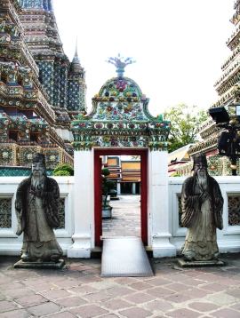 Stone guardians by Wat Pho temple gate