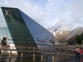 Louis Vuitton floating pavilion with lotus-shaped ArtScience Museum in background