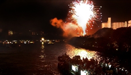 Tenjin Matsuri fireworks on the river bank